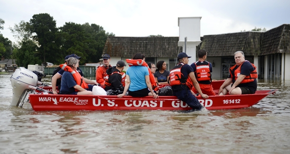 Coast Guardsmen rescue stranded residents from high water during severe flooding around Baton Rouge, LA on Aug. 14, 2016. Coast Guard photo by Petty Officer 3rd Class Brandon Giles