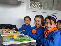 Syrian school children with school supplies