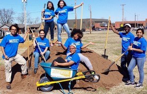 volunteers, wheelbarrow; photo by University of North Texas