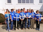 Volunteers wearing blue tshirts and holding crosses