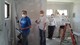four volunteers working on drywall
